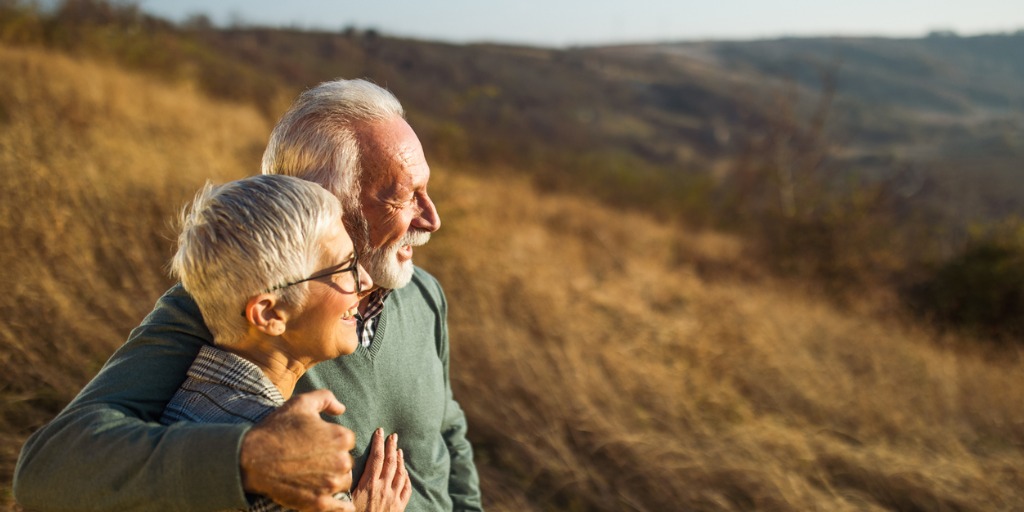 Senior couple overlooking field